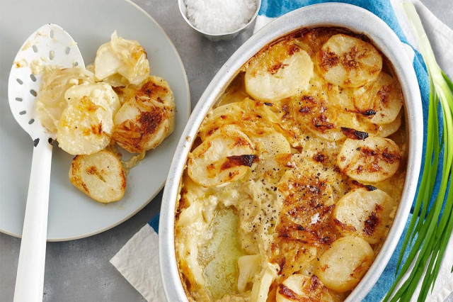 Baked potatoes in the oven with sour cream