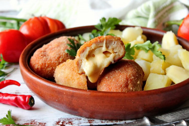 Chicken cutlets with cheese in the oven