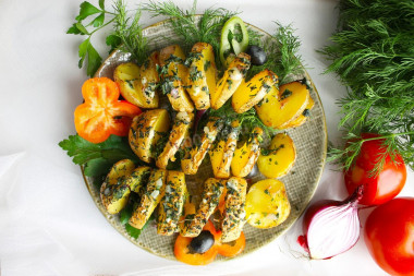 Potatoes spiral on skewers in the oven