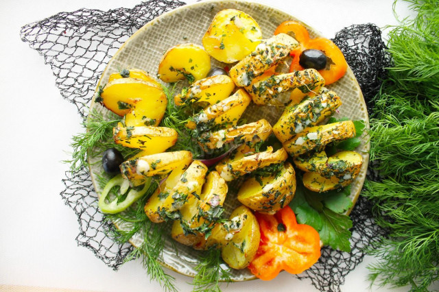 Potatoes spiral on skewers in the oven