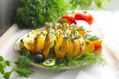 Potatoes spiral on skewers in the oven