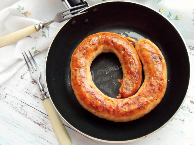 Homemade sausage fried in a pan