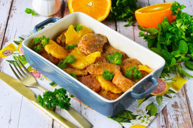 Pork meat with oranges in the oven