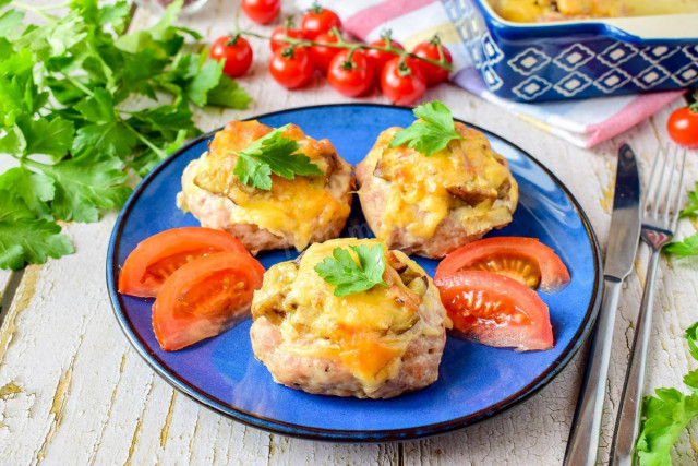 Stacks of minced mushrooms with cheese in the oven