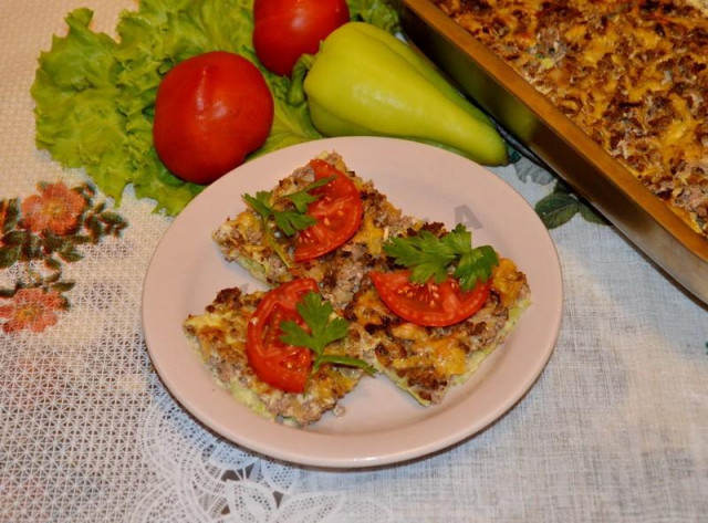 Grated casserole zucchini with minced meat in the oven