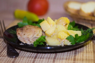 Chicken in a duck house in the oven with potatoes