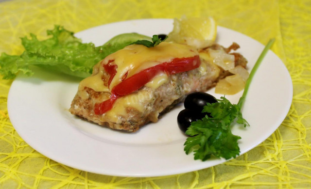 Pink salmon with tomatoes and hard cheese in the oven