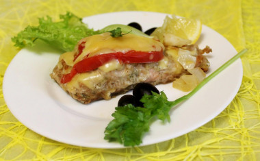 Pink salmon with tomatoes and hard cheese in the oven