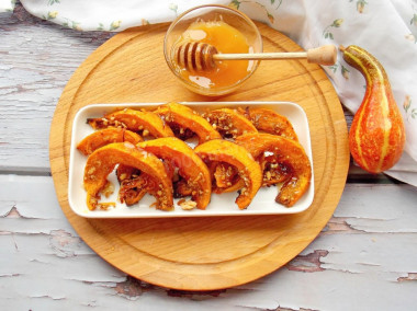 Honey Dessert made of pumpkin pieces baked in the oven