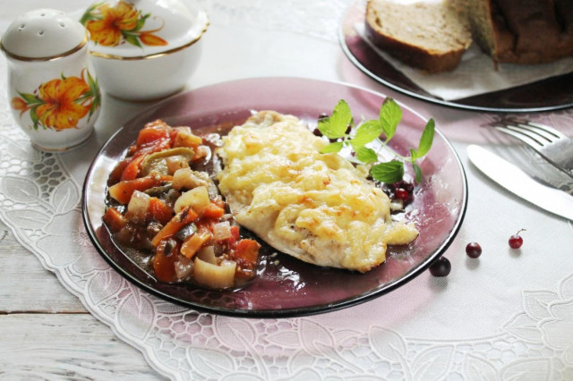 Cheese chicken breast with onions in the oven