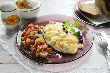 Cheese chicken breast with onions in the oven