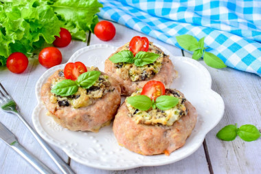 Nests with minced meat in the oven with mushrooms