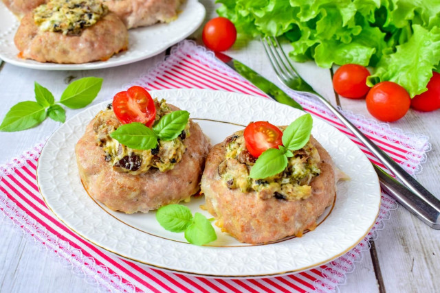 Nests with minced meat in the oven with mushrooms