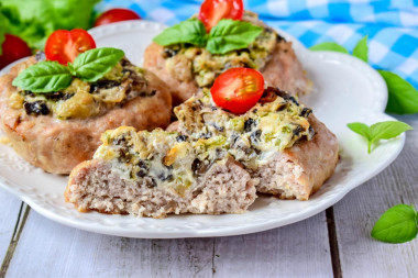 Nests with minced meat in the oven with mushrooms