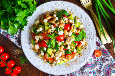 Salad with canned white beans, cucumber and chicken