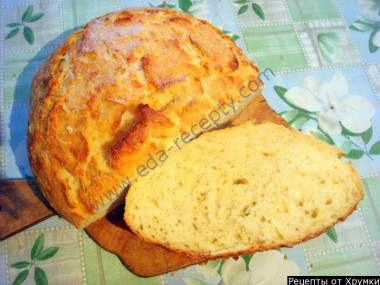 Homemade bread with dry yeast and hard cheese in the oven