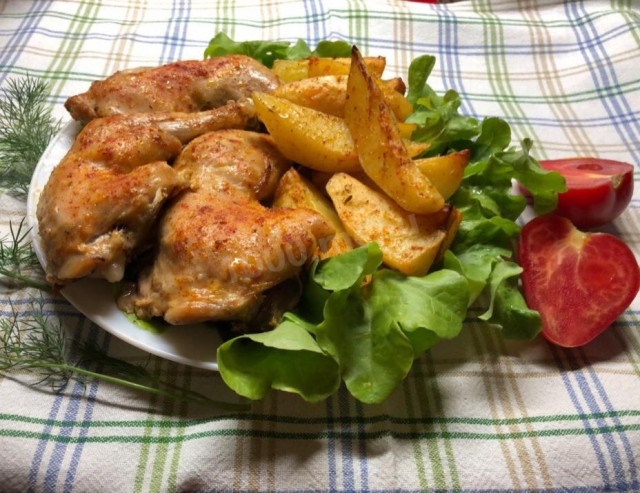 Chicken legs with potatoes in the oven