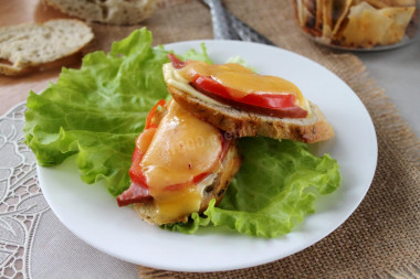 Sandwiches in the oven with boiled sausage and cheese