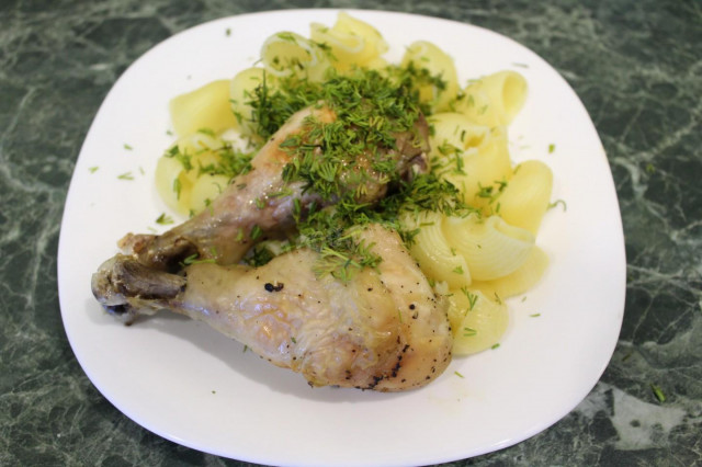 Chicken legs with lemon in foil in the oven