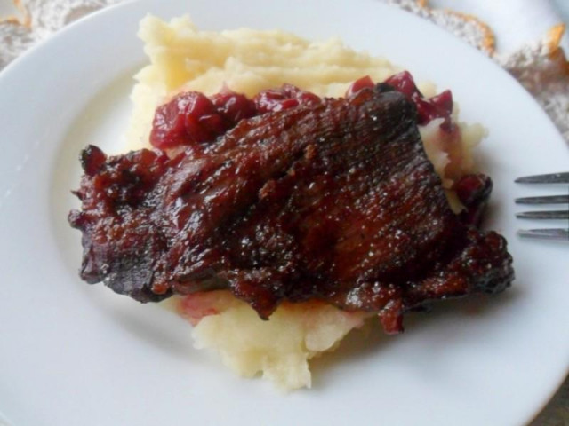 Meat with cherry juice and berries in the oven