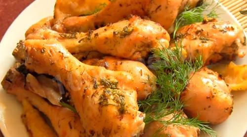 Chicken legs baked in the oven with lemon