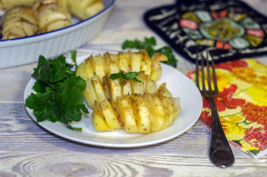 Accordion potatoes with bacon in the oven