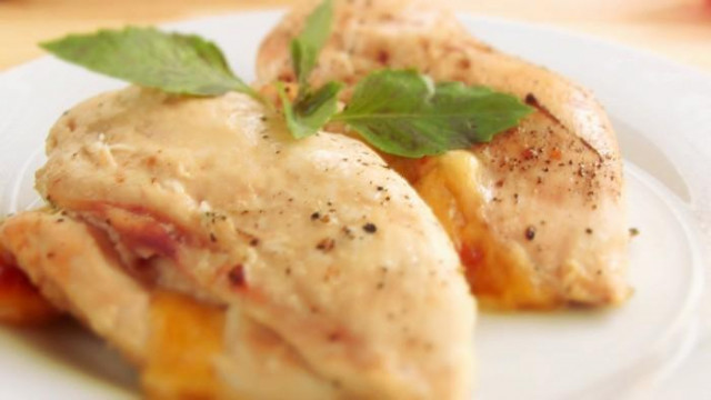 Chicken fillet with cheese and tomatoes in the oven