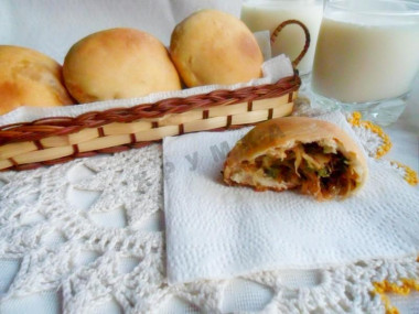 Yeast pies with cabbage and egg in the oven