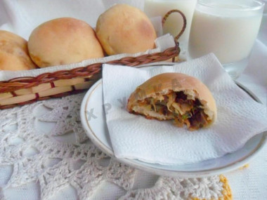 Yeast pies with cabbage and egg in the oven