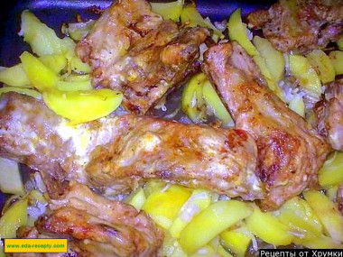 Chicken legs with potatoes and mushrooms in the oven