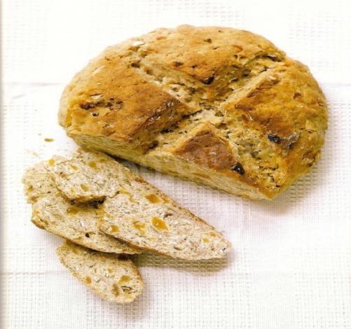 Bread in the oven made from corn flour with honey and apricots