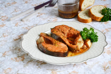 Fried trout in a frying pan