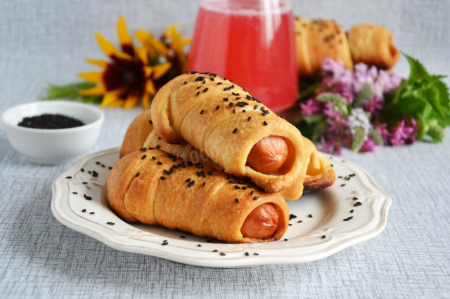 Sausages in puff pastry in the oven