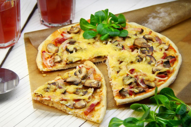 Pizza with ham mushrooms and cheese