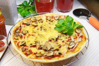 Pizza with ham mushrooms and cheese