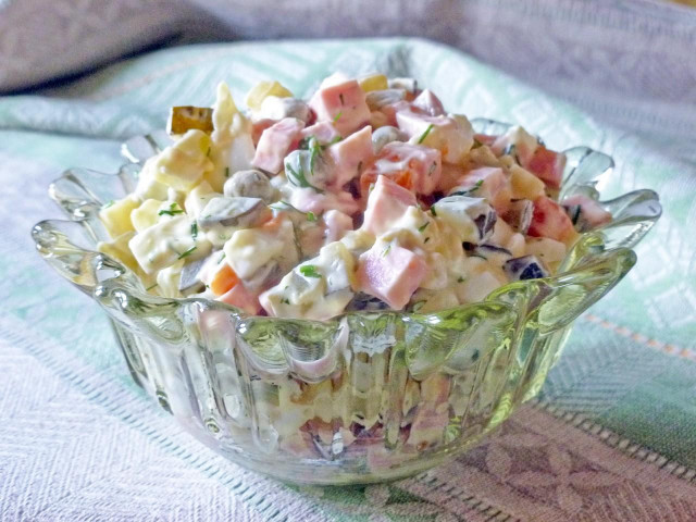 Olivier salad with pickles and sausage classic