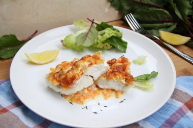 Hake in the oven with onions, carrots and sour cream