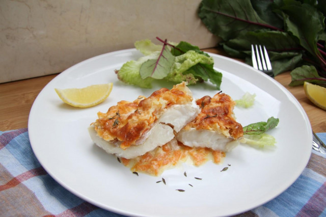 Hake in the oven with onions, carrots and sour cream