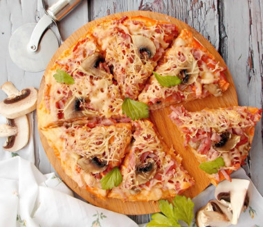 Pizza with sausage, mushrooms and cheese