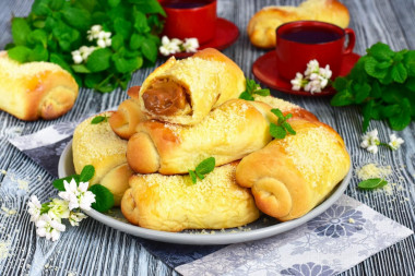 Buns with condensed milk boiled from yeast dough