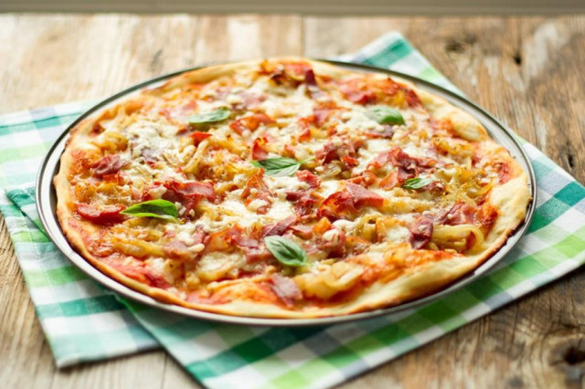 Pizza on a Cheddar baking sheet