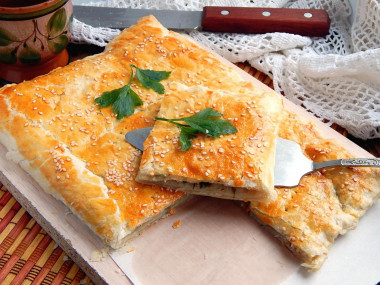 Puff pastry pie with minced meat and potatoes