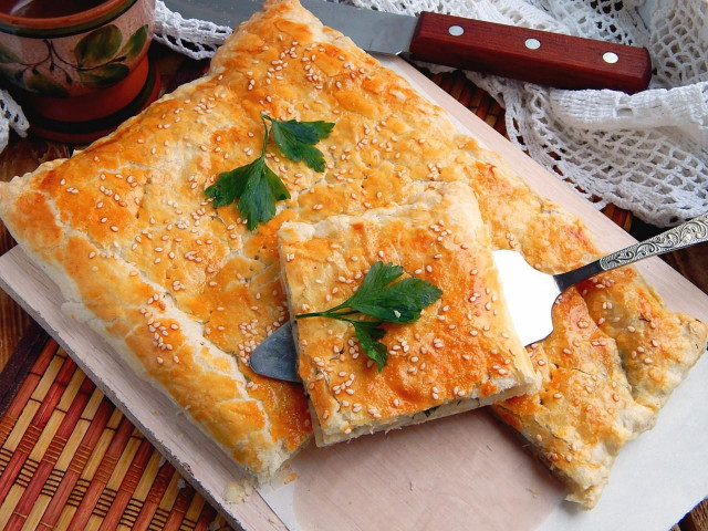 Puff pastry pie with minced meat and potatoes