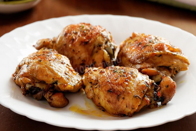 Chicken thighs on a baking sheet