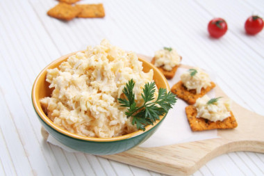 Cheese salad with garlic, egg and mayonnaise