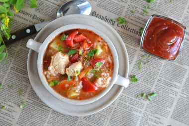 Soup with rice, tomato paste and chicken