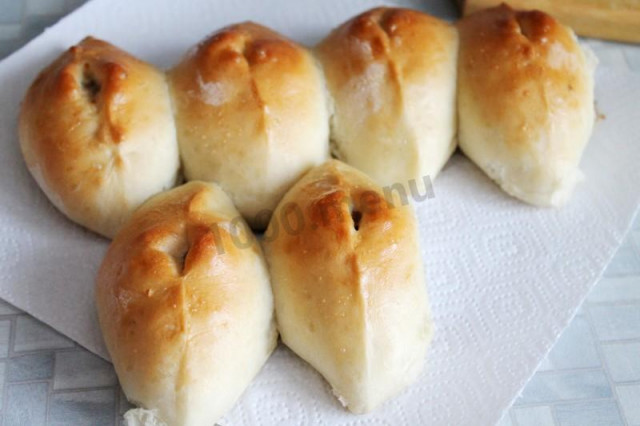 Baked yeast dough pies with mushrooms