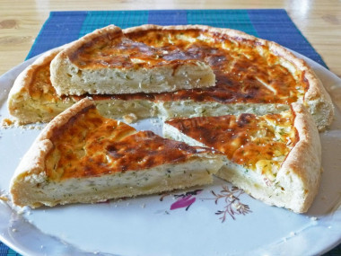 Pie with melted cheese and onions