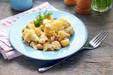 Cauliflower with egg in a frying pan