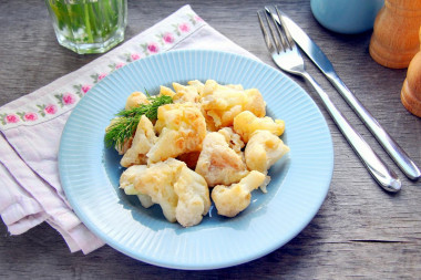 Cauliflower with egg in a frying pan